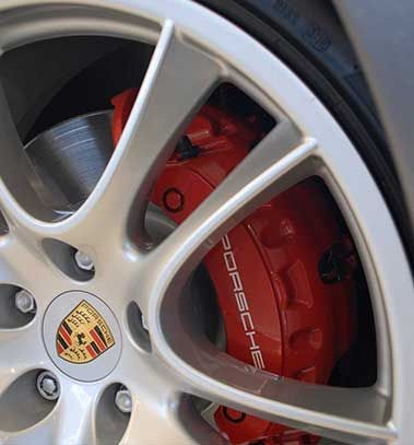 Porsche alloy wheel with red brake caliper